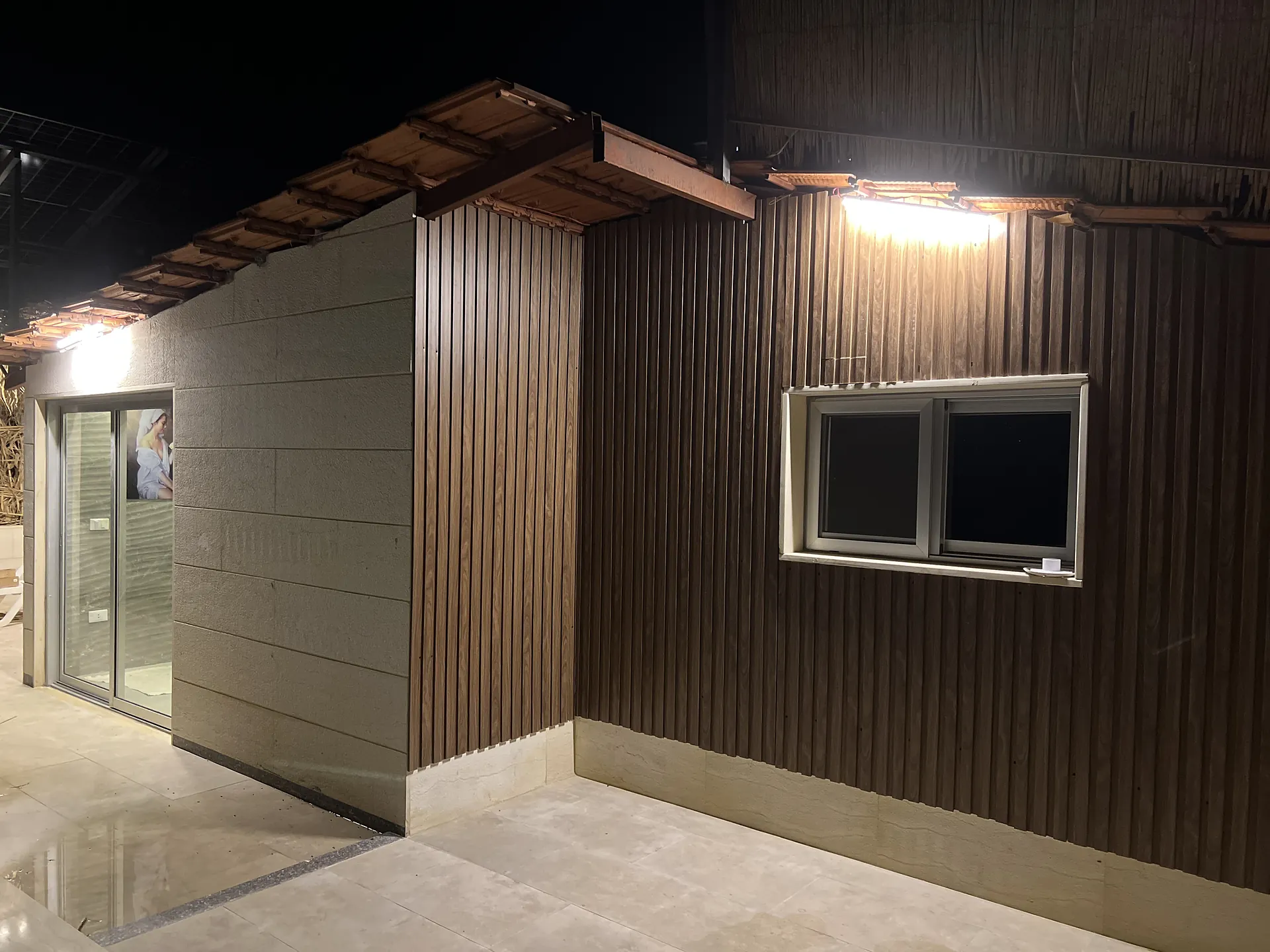 The chalet and its terrace lit at night